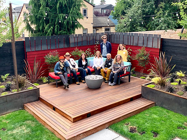 APLDWA members sitting on a deck at a member designed garden