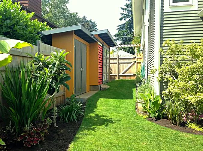 Two contemporary storage sheds of varying heights and depths in bright colors