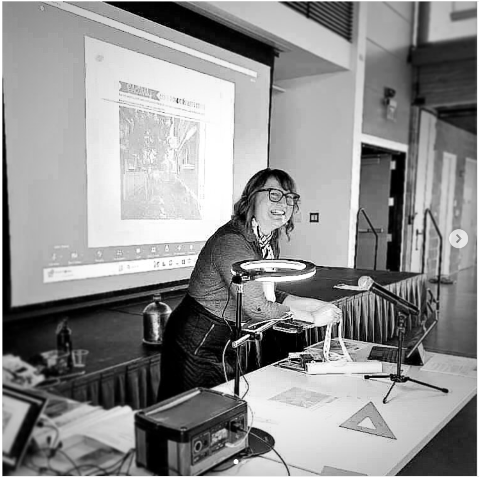 woman using overhead projector in a meeting.