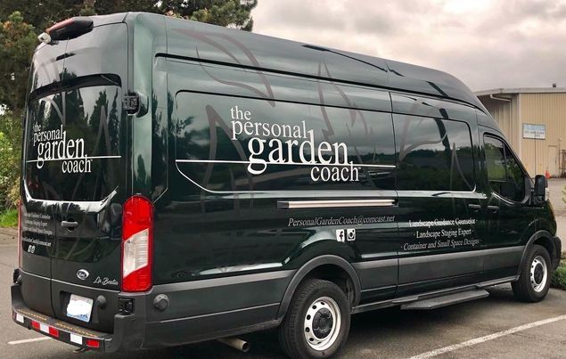 Side of a van with text on the side.