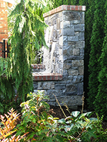 Water Feature by Vanessa Gardner  Nagel - Side view of new stone and brick-trimmed water feature